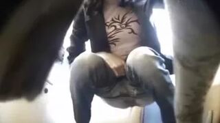 Desperate Brunette Tickles in Public WC