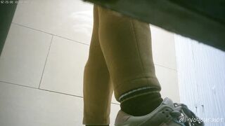 Sneak shot of women's restroom in shopping mall 18