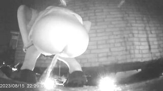 Chinese girl with a powerful stream peeing in a hidden corner of a night market 2